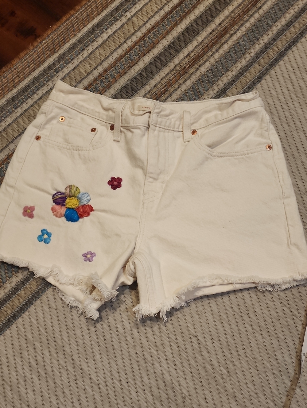 Levi's Cream Denim Cutoff Shorts with Multicolor Embroidered Flowers